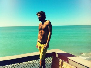 A man standing on the edge of a pier.